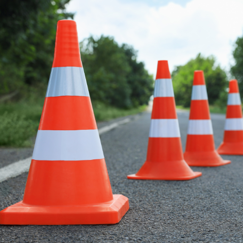 Traffic cones lined up on a road