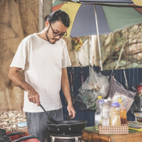 Man cooking outdoors